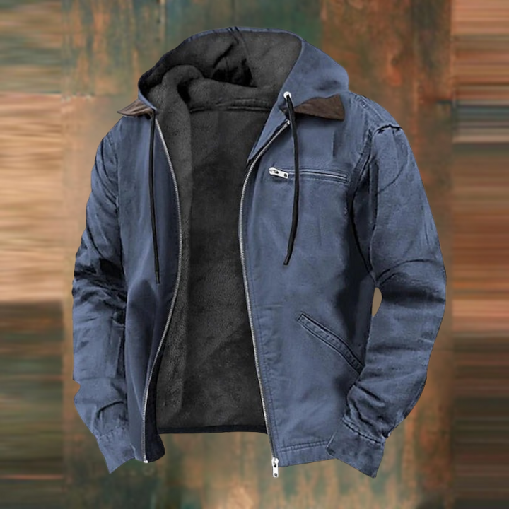 Dieselbe Jacke in gedecktem Blau, offen fotografiert, mit dunkelgrauem Fleecefutter und Reißverschluss-Brusttasche. 3