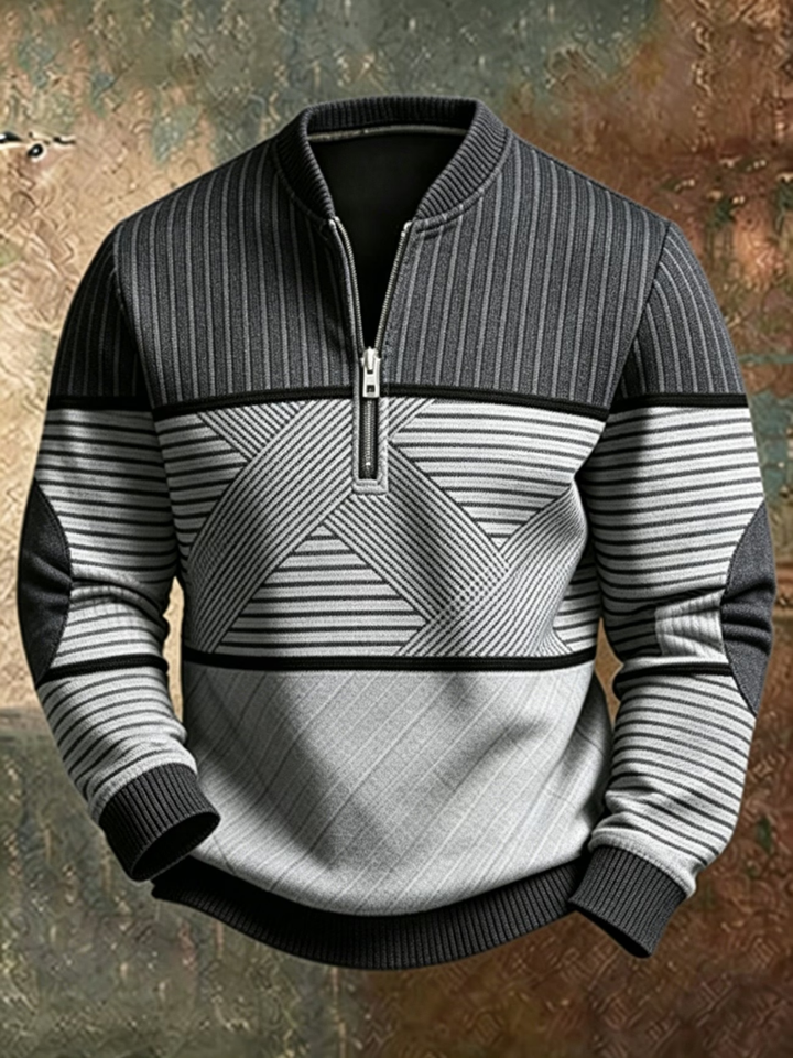 Pullover mit Stehkragen und halbem Reißverschluss in Dunkelgrau und Hellgrau, gestreift und mit geometrischem Kontrastmuster, vorne abgebildet. 2