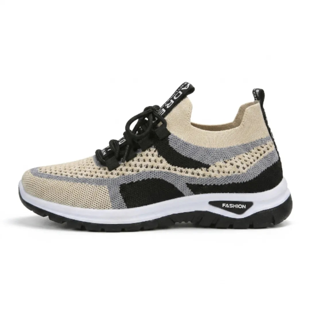 Einzelner beige-schwarzer Mesh-Sneaker mit grauen Streifen und schwarzer Schnürung in Seitenansicht, weiße Zwischensohle, schwarze Laufsohle. 37
