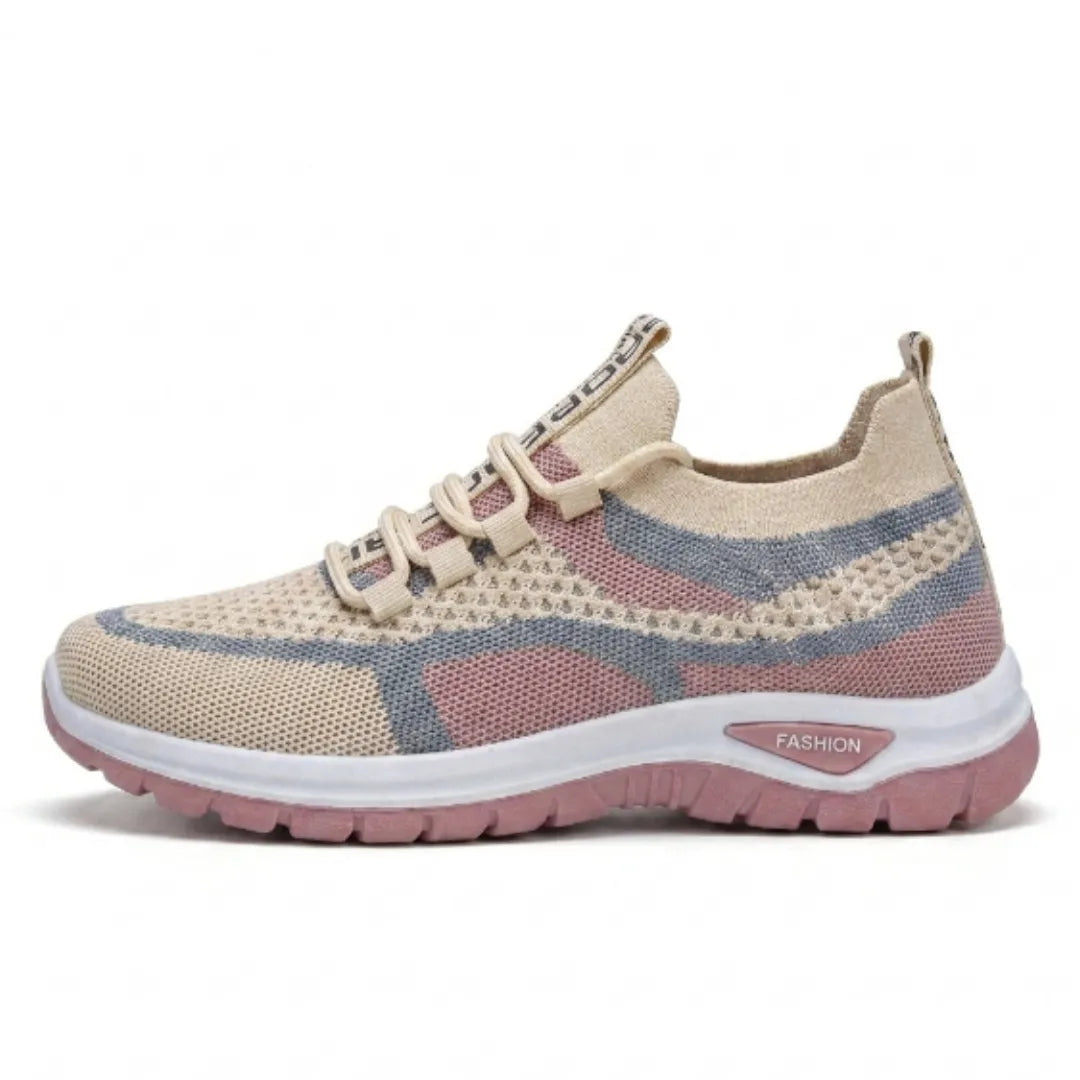 Einzelner beige-rosa-blauer Mesh-Sneaker in Seitenansicht mit weißer Zwischensohle und rosa Laufsohle. 28