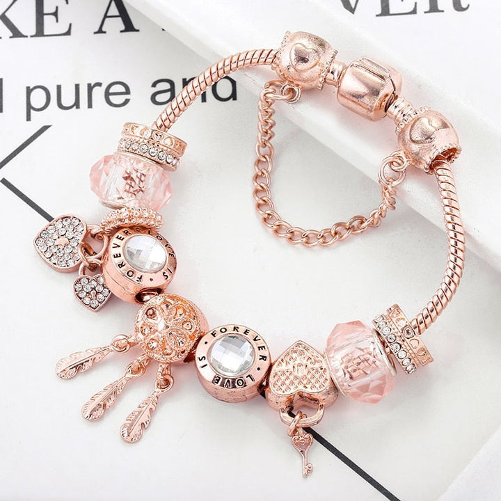 Rose dreamcatcher bracelet with charms made of sterling silver - pink