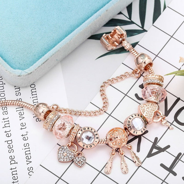 Rose dreamcatcher bracelet with charms made of sterling silver - pink