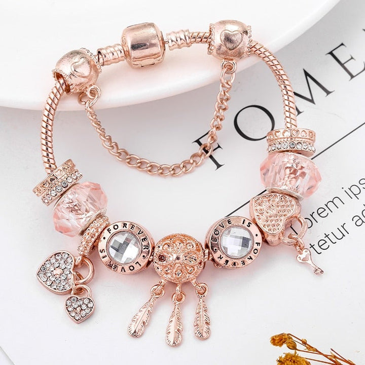 Rose dreamcatcher bracelet with charms made of sterling silver - pink