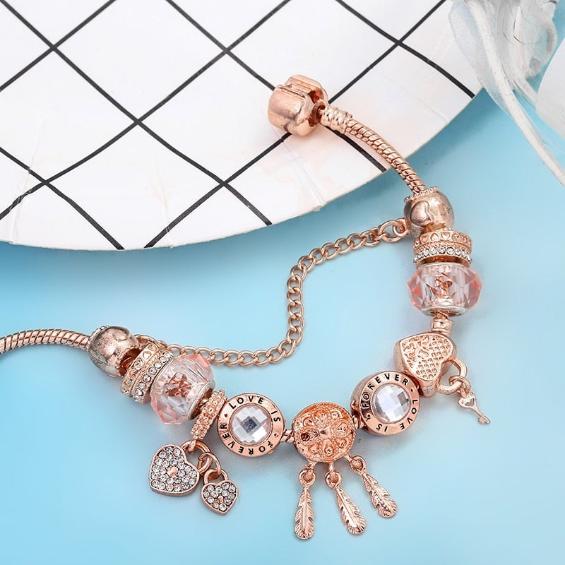 Rose dreamcatcher bracelet with charms made of sterling silver - pink