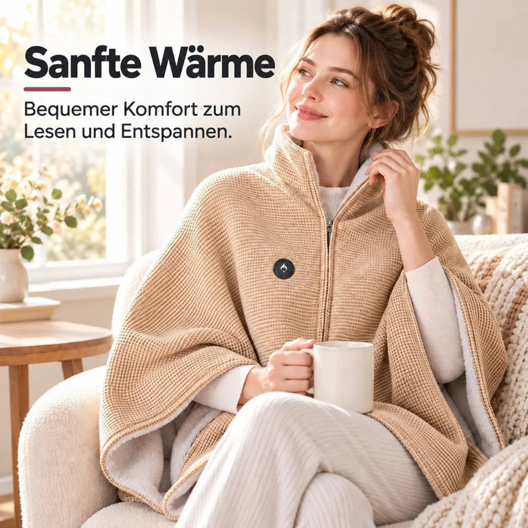 Frau im Sessel mit Tasse trägt die beige Decke mit Stehkragen und Heizknopf 6