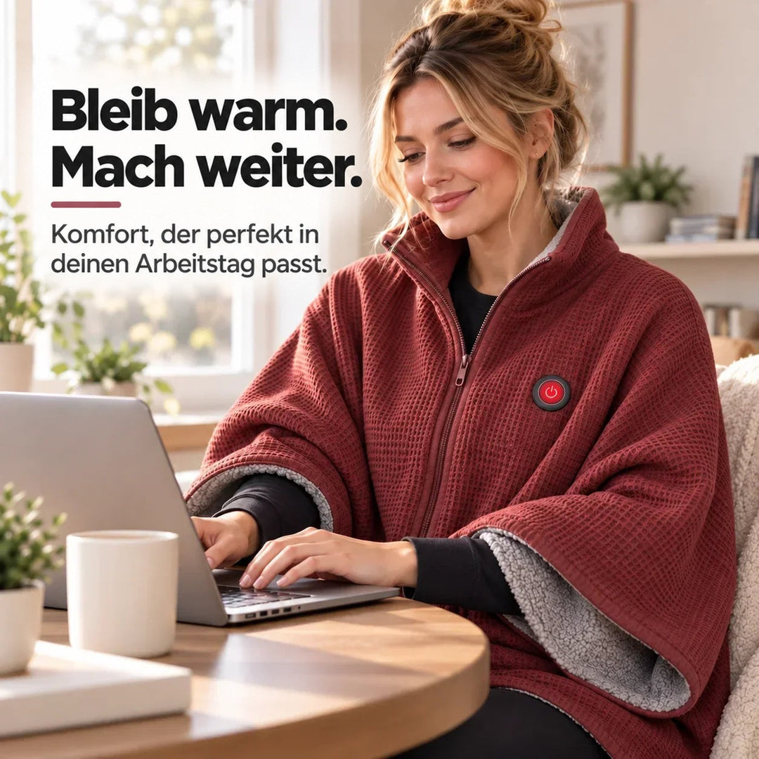 Frau arbeitet am Laptop und trägt dabei die rote Decke mit grauem Innenfutter 11