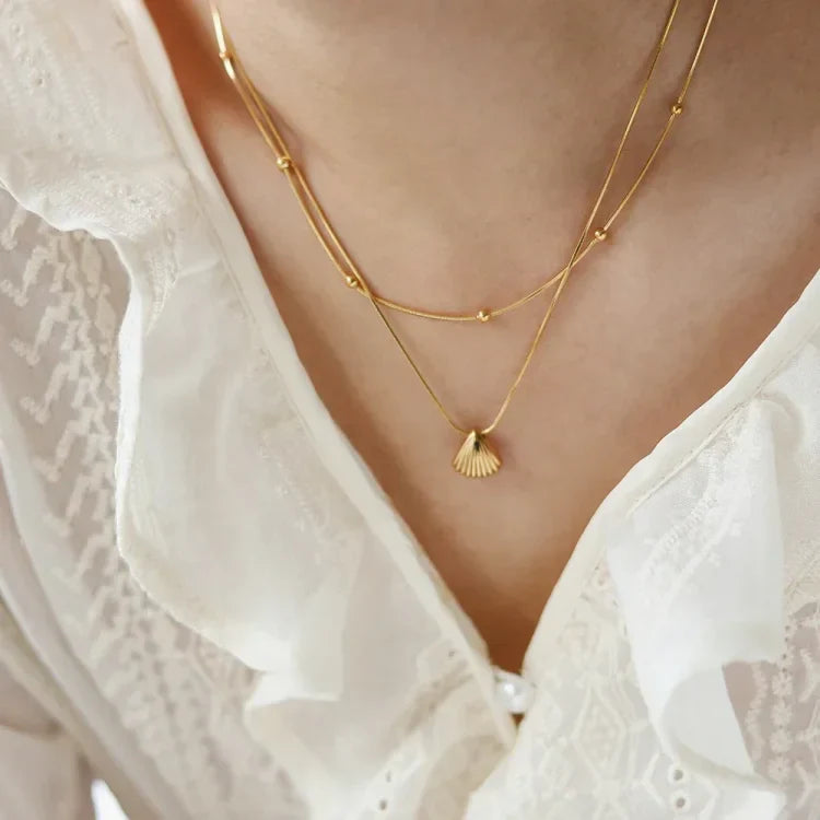 Gullfarget kamskjell-blomsterkjede – Lilla