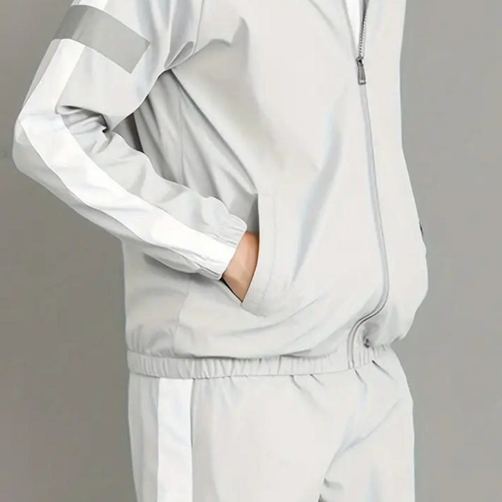 Grauer Trainingsanzug mit weißen Streifen, Reißverschluss, Sportbekleidung, Unisex, Polyester.