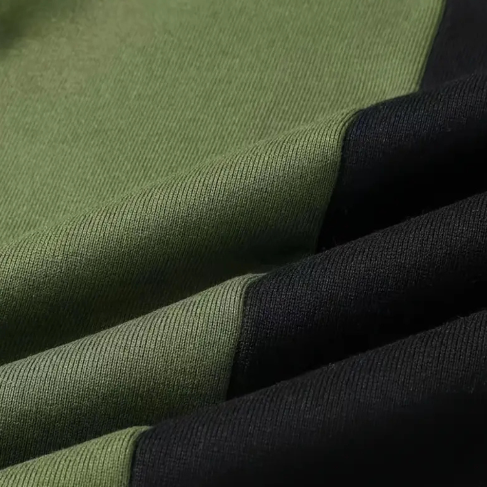 Grüner und schwarzer Baumwollstoff, Nahaufnahme, Textilmaterial, hochwertige Bekleidungsstoffe.