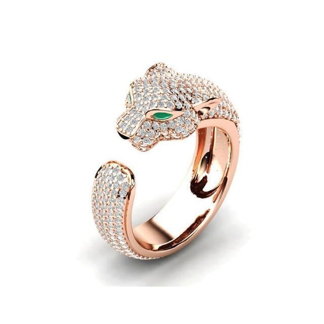 Justerbar ring i 18K sølv og roségull med grønne zirkoniaøyne – jaguarring